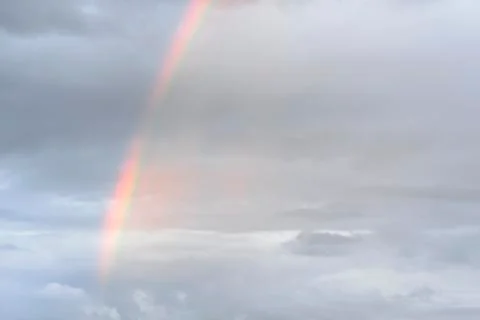 Rainbow in clouds Stock Photos