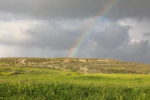 Rainbow in the cloudy sky during the rain. Background with copy space for text Stock-Fotos
