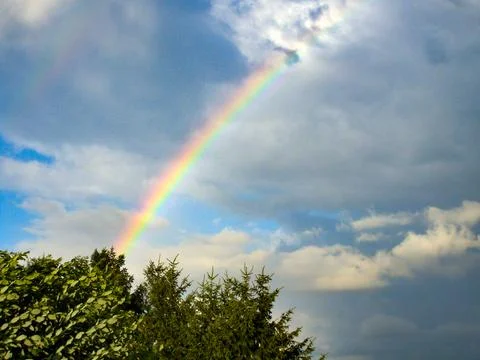 Rainbow in a cloudy sky in Germany Stock Photos