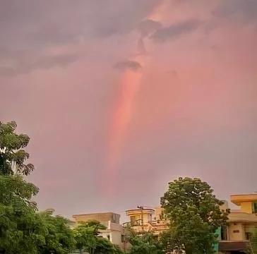 Rainbow cloudy sky Stock Photos
