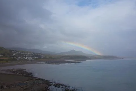 Rainbow by the coast Stock Photos