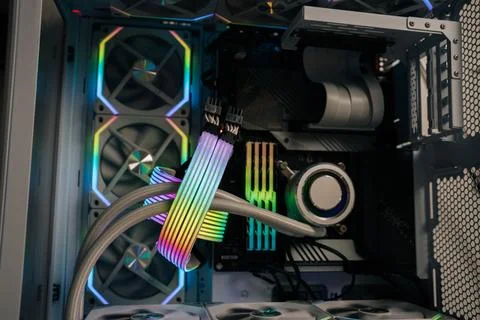 Rainbow-colored cables illuminate interior of custom-built gaming computer Stock Photos