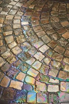 Rainbow-Colored Cobbled Ground After Rain Stock Photos
