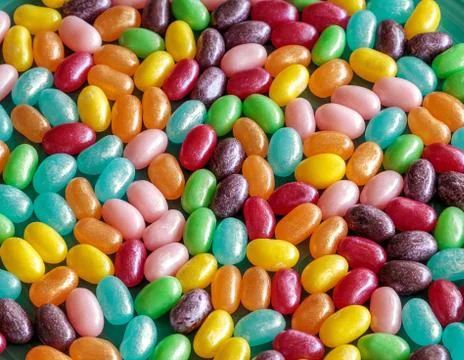 Rainbow colored jellybeans at Easter Stock Photos