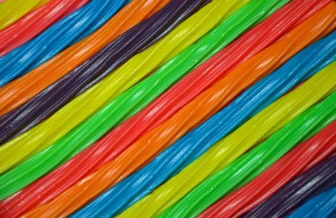Rainbow colored licorice background Stock Photos