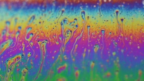 Rainbow colored liquid background in motion Stock Footage 133697325
