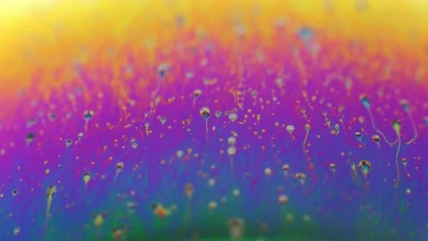 Rainbow colored liquid background in motion Stock Footage 133697548