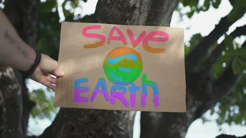 A rainbow colored poster from the demonstration "Save the Earth" Stock Footage 146887529