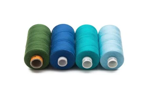 Rainbow colored sewing thread lined Stock Photos
