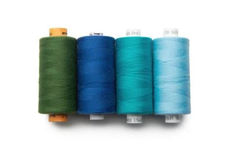 Rainbow colored sewing thread lined Stock Photos