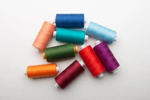 Rainbow colored sewing thread lined Stock Photos