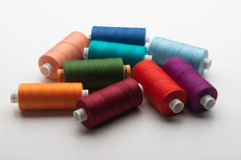 Rainbow colored sewing thread lined Stock Photos