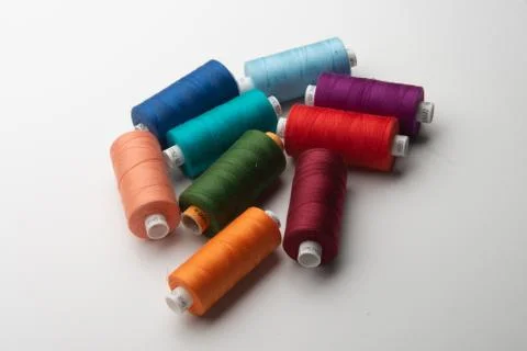 Rainbow colored sewing thread lined Stock Photos