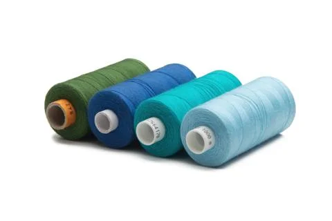 Rainbow colored sewing thread lined Stock Photos