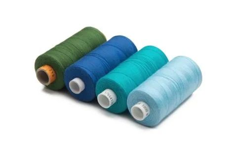 Rainbow colored sewing thread lined Stock Photos