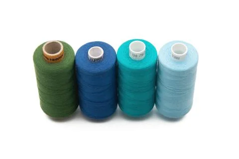Rainbow colored sewing thread lined Stock Photos