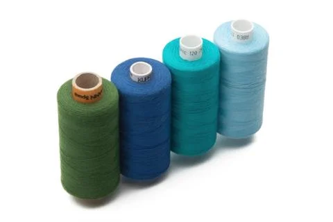 Rainbow colored sewing thread lined Stock Photos