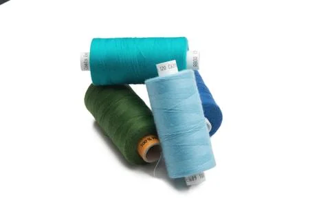 Rainbow colored sewing thread lined Stock Photos