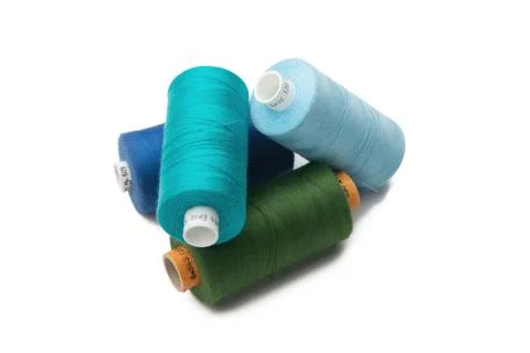 Rainbow colored sewing thread lined Stock Photos