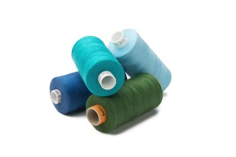Rainbow colored sewing thread lined Stock Photos