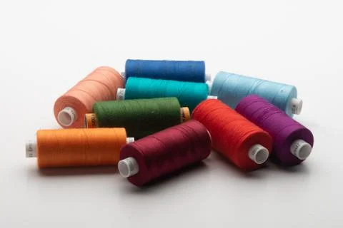 Rainbow colored sewing thread lined Stock Photos