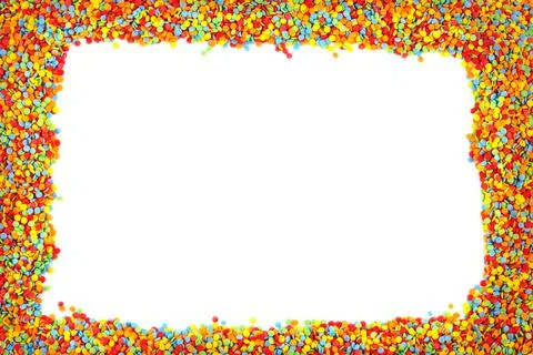 Rainbow colored sugar sprinkle dots, decorative frame mockup. Stock Photos