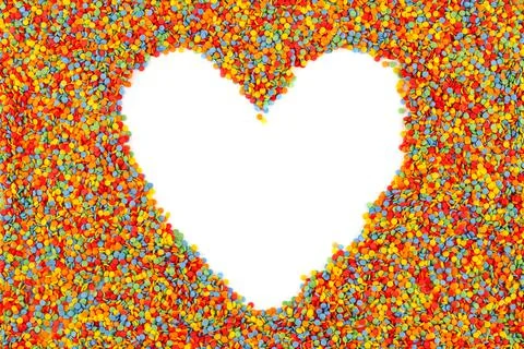 Rainbow colored sugar sprinkle dots, decorative heart shape frame mockup Stock Photos