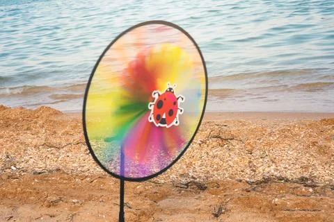 Rainbow colored wind mill toy Stock Photos