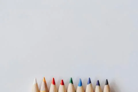 Rainbow of coloring pencil tips on plain white background Stock Photos