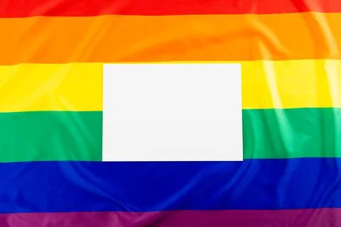 Rainbow coloured flag with white rectangle and copy space Foto stock