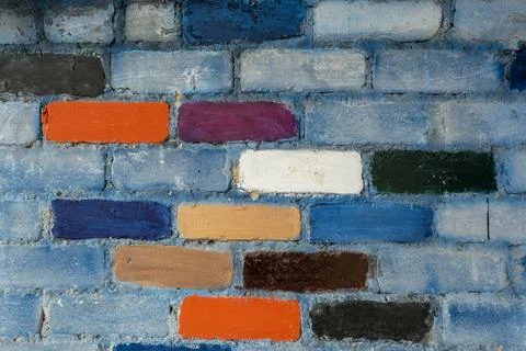 Rainbow colourful brick wall background. brick wall texture with colorful blo Stock Photos