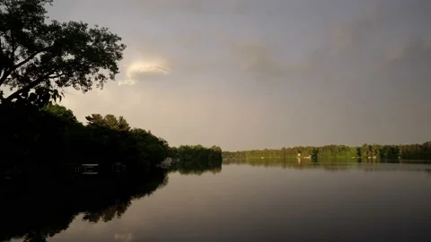 Rainbow coming down on a river. Video stock 148676346