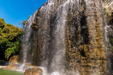 The rainbow created by the man-made waterfall on the touristic Castle Hill of Stock Photos
