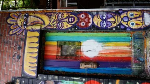 Rainbow door with a side of faces Stock Photos