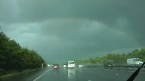 Rainbow during thunderstorm over M25 London, point of view from vehicle. 動画素材 12402318