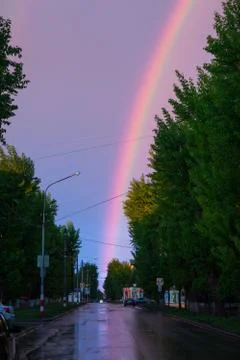 Rainbow at the end of the road Stock Photos