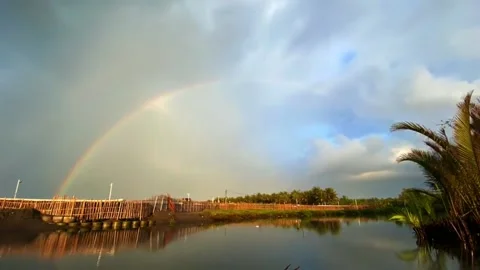 Rainbow at the end of the setting sun Stock Footage 229712965