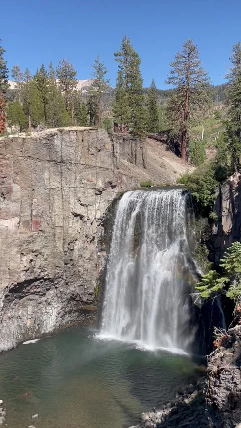 Rainbow Falls overlook with rocks and trees in the background  Video stock 217593513