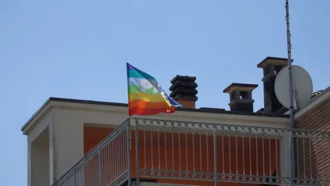 Rainbow flag fluttering in the wind. Peace lettering. LGBT flag. Stock Footage 201204527