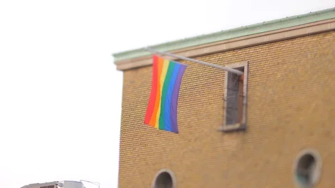 Rainbow flag hanging vertically on a fla... | Stock Video | Pond5