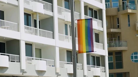 Rainbow flag / LGBT Pride flag showing in the streets Stock Footage 110661172