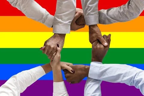 Rainbow flag pattern with hands for LGBT pride for transgender day of memo... Stock Photos