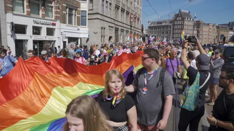 Rainbow Flag on Protest Walk Crowd Lhbti+ Gay Pride Netherlands Amsterdam Stock Footage 234409306