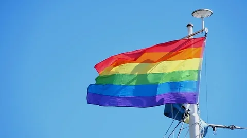 Rainbow flag on a ship waving in slow motion Stock Footage 93668623