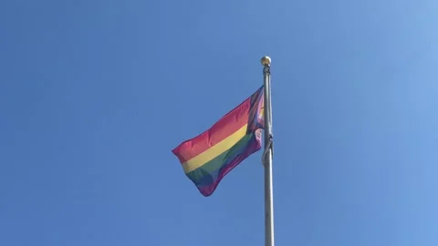 Rainbow Flag on Sunny Day with Blue Skies Stock Footage 280879273