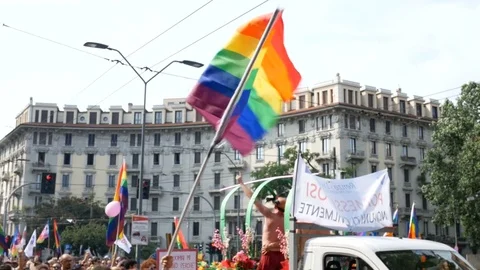 Rainbow flag waves at Milano pride parade. Video stock 79636233