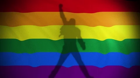 A Rainbow flag waves with a shadow that reminds us to Freddie Mercury Vídeo Stock 130836525