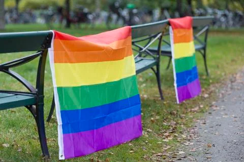 Rainbow Flags hanging on benches Stock Photos