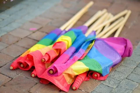 Rainbow flags laying on the ground during the Lgbt Pride Parade. Stock Photos