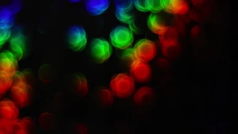 Rainbow flower bokeh lights gradually blurring on a dark abstract backgroun.. Stock Footage 340034534